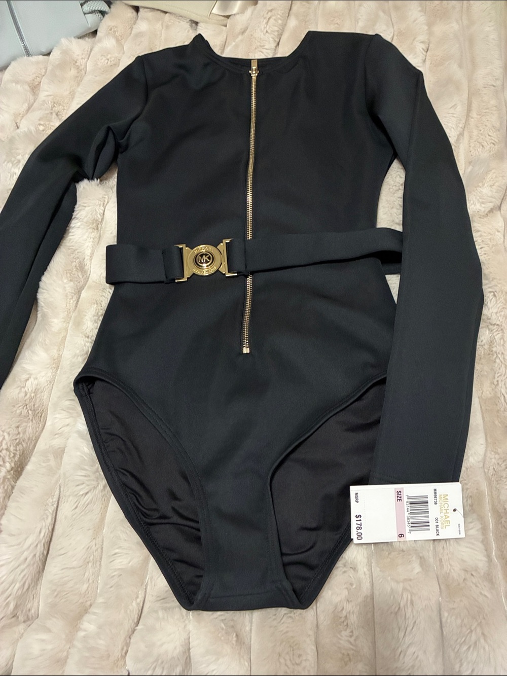 Woman Michael Kors Black Long-Sleeve One-Piece with Gold Hardware Belt